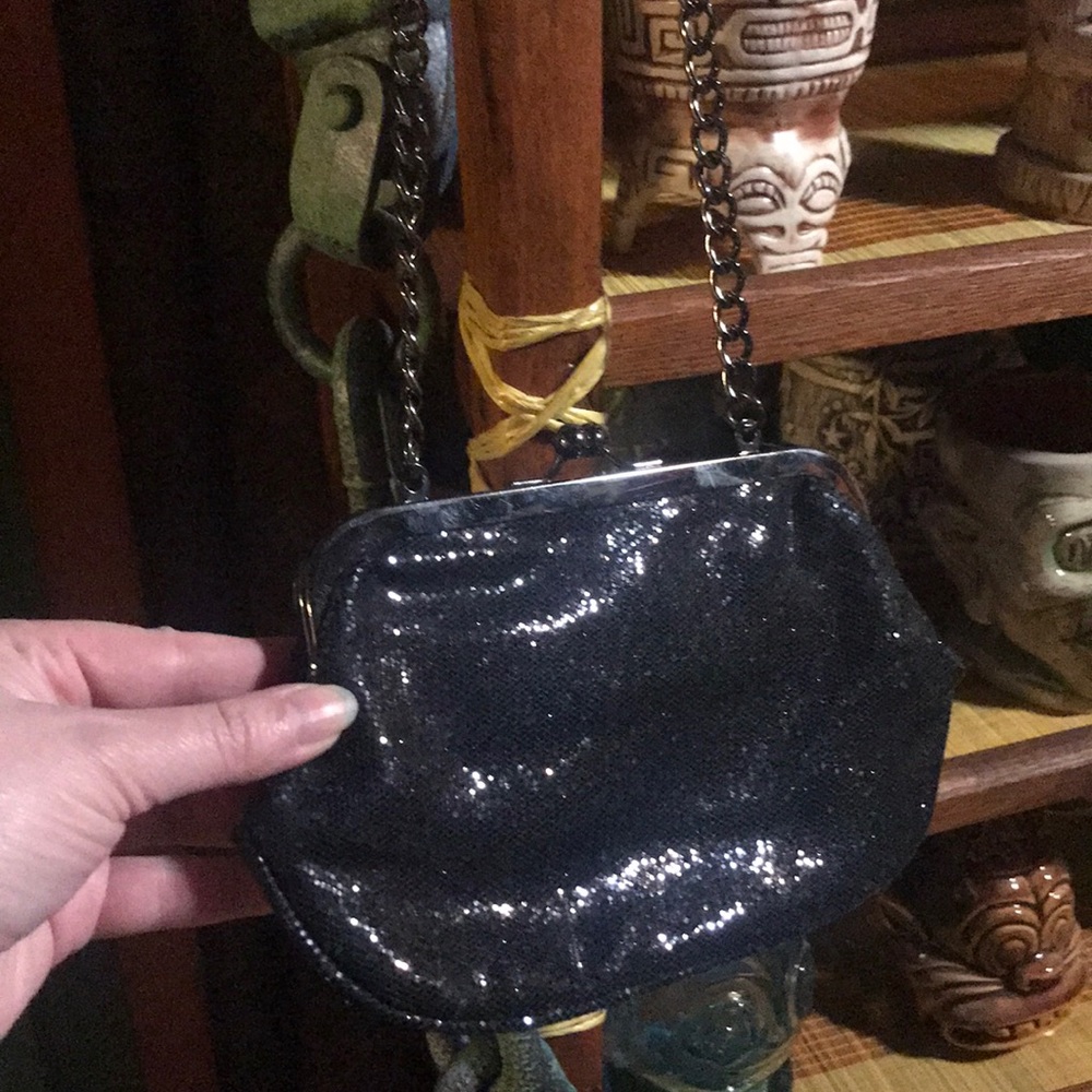 Express sparkle clutch with black chain.